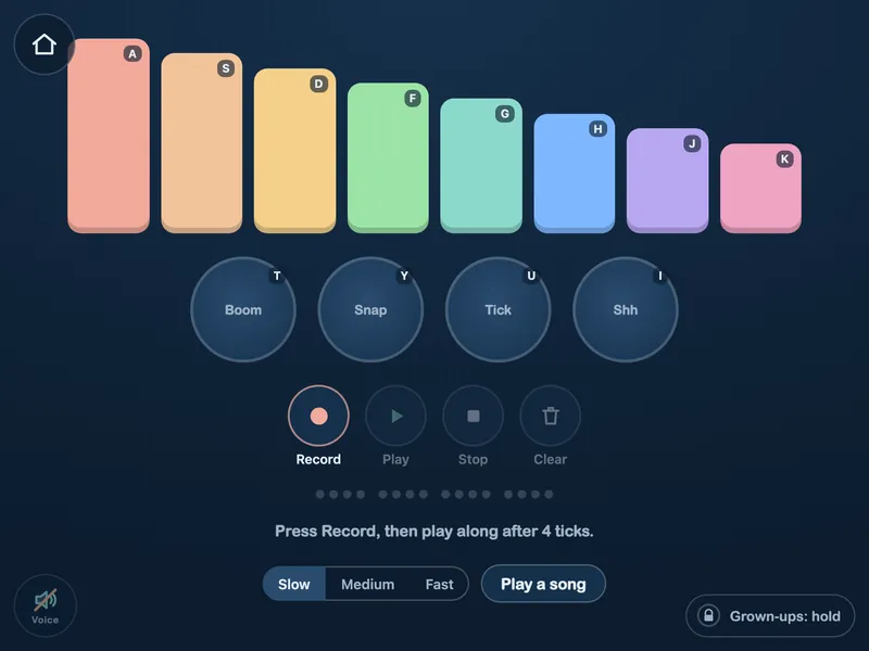 The Music Maker: a xylophone of eight colored bars and four drums